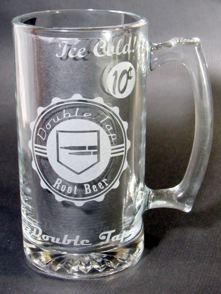 Front view of empty etched glass mug