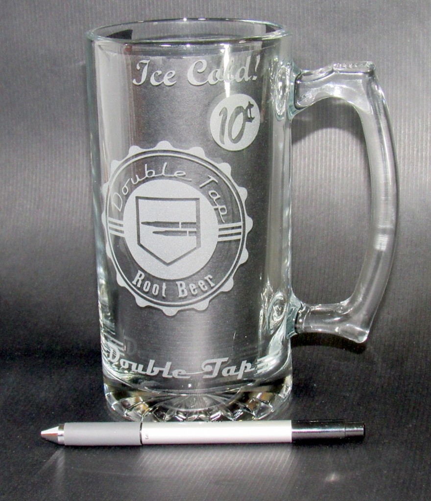 An empty Double Tap Mug with ballpoint ink pen on table to demonstrate scale