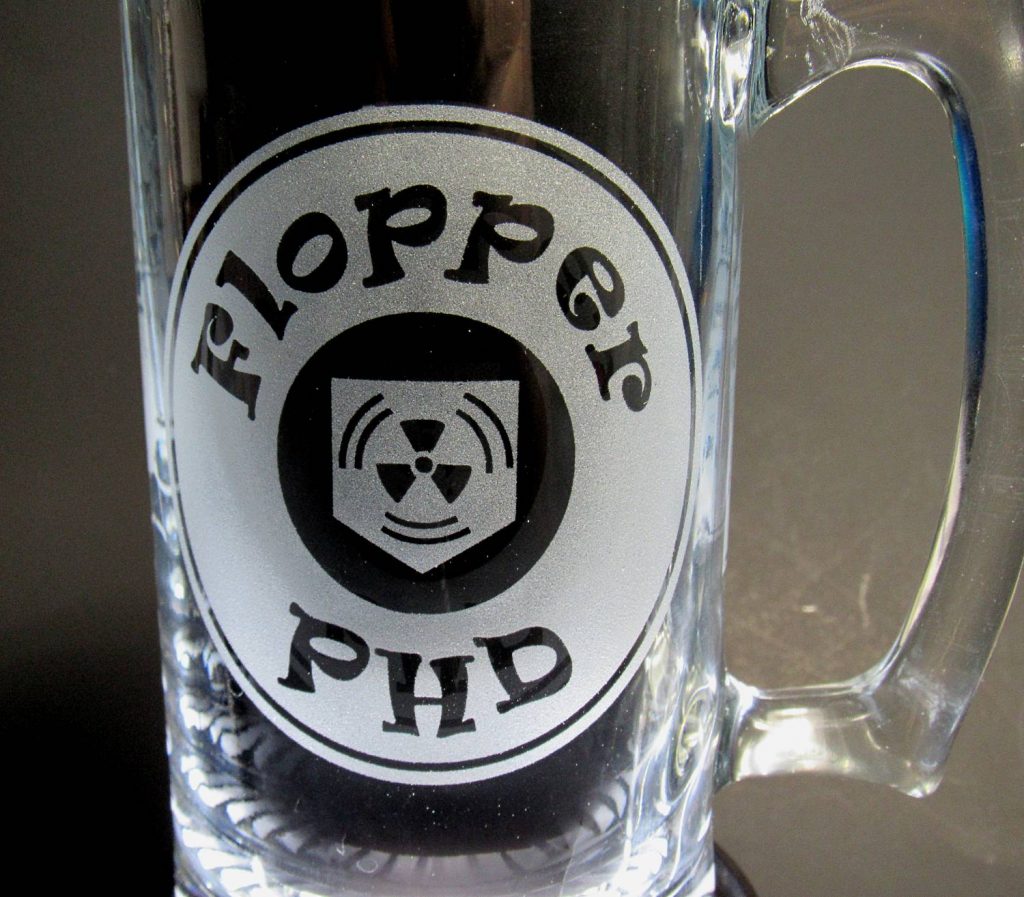 An extreme closeup of the front of the PHD flopper mug showing the logo.